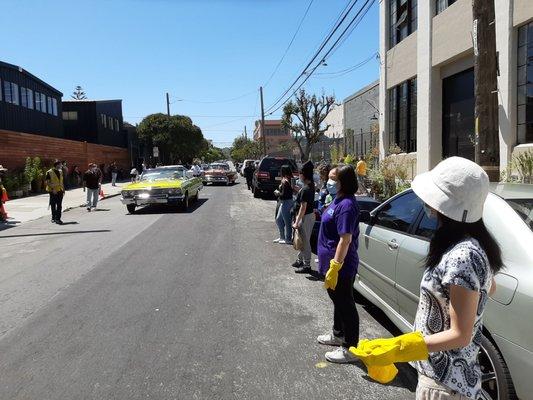 Low riders pulling up to celebrate mini Carnaval celebration at Mission Food Hub on Sunday, May 24, 2020.