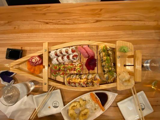 Sushi boat...fun and delicious.  Great sushi and awesome staff.  Highly recommend for those that appreciate good fresh sushi.