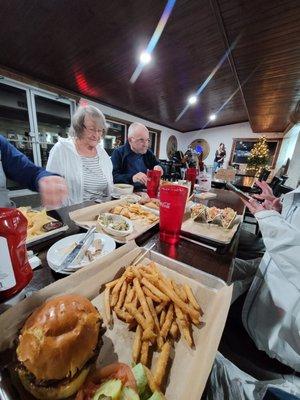 Eating the great food and enjoying the live entertainment!