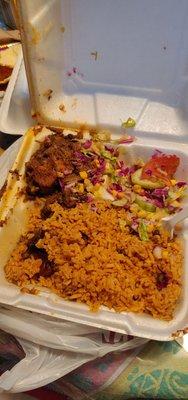 Beef, yellow rice with beans, salad, platanos