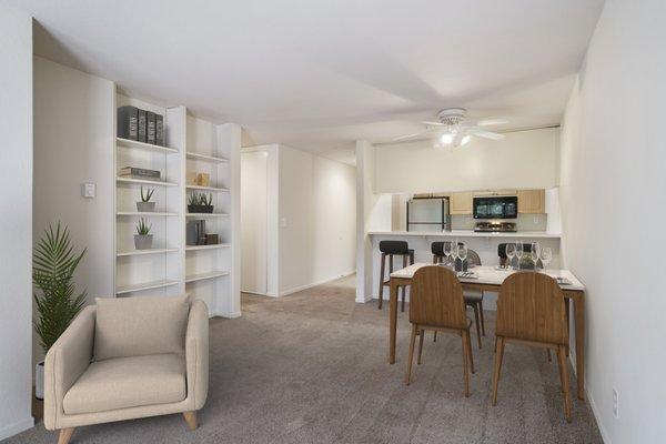 living room with 2 built in bookcase , bar at kitchen, and dining area 2x2 plan