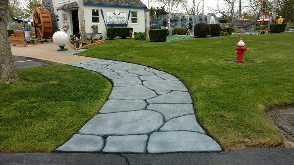 Hand carved sidewalk.. No stamps!