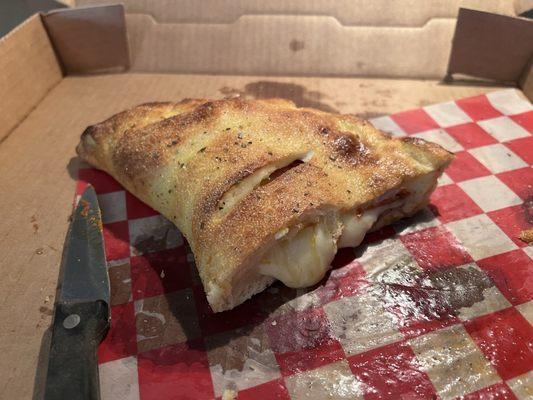 Calzone with pepperoni and mushrooms.