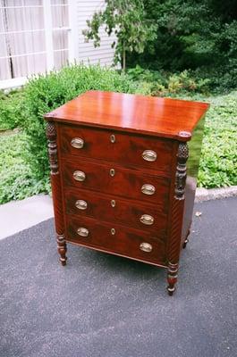 A restored antique mahogany small chest.