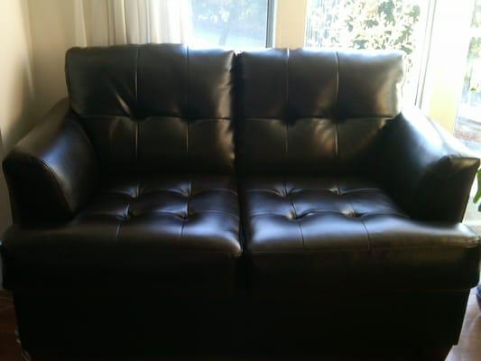 Comfy, leather blend sofa and love seat for $900