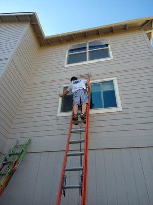 Exterior painting of two story home in Kendal.