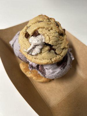 Chocolate chip cookie ice cream sandwich infused with Oreo buttercream and blackberry ice cream.