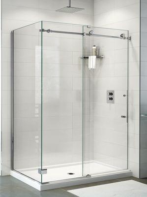 A modern shower enclosure in all glass makes a small bathroom appear larger.