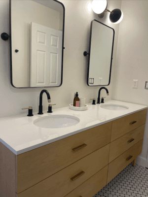 Dual vanity and radius framed mirrors features modern elements