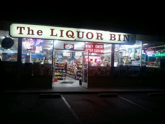 The entrance to the Liquor Bin after dark.