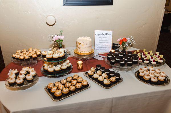 Assorted mini cupcakes and a 6 inch cake for our wedding.