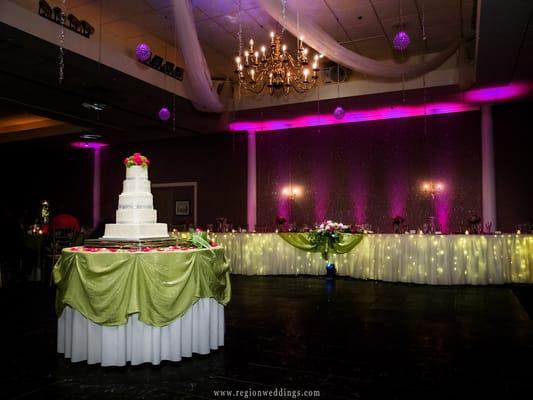 Pink uplights contrast with lime green linens for this amazing night!