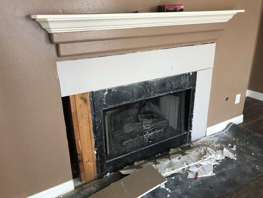 Demo of old tile around fireplace