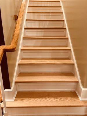 From rags to riches! New staircase installation with natural Red Oak stair treads and shaker style risers. Cost: $4500.