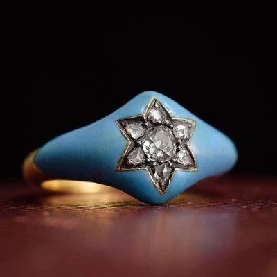 Unusual, right? A mid Victorian ring in 15k yellow gold with robin's egg blue enamel, sparkling with a flower/starburst design.