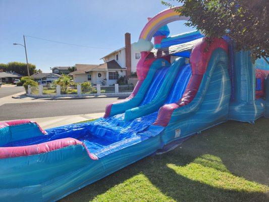 Bouncer house with 2 slides and a pool for the kids to land in.