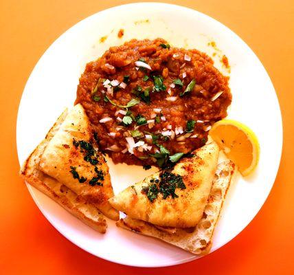 Pav Bhaji - A popular Indian street food with a mix of veggies and house pav bhaji masala. Comes with a side of Masala Buns.