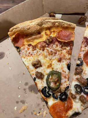 Very little pepperoni, black olives or sausage and no cheese near the edge! We didn't ordered jalapeno but got one anyway!