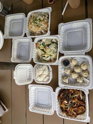 Young Chow fried rice, soup dumplings, lo mein and a assortment of stir fry vegetables.