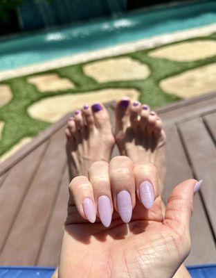 Admiring my mani/pedi poolside.