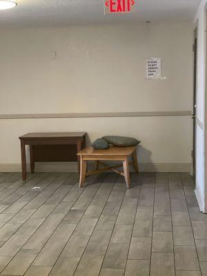 Random furniture in the hall. Please do not remove trash can sign but no trash can.