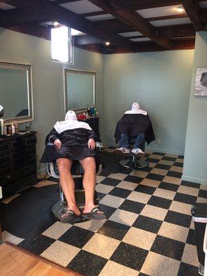 Relaxing with a hot towel shave.