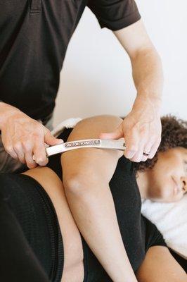 Graston scraping technique breaks up scar tissue, increases blood flow, and stimulates the body's natural healing response.