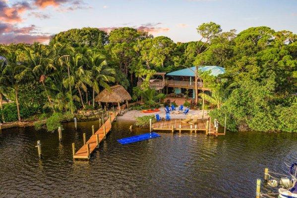 Stay at The River House in Jupiter, FL! Private beach, spa, kayaks & vintage coastal charm. Unforgettable riverfront getaway!