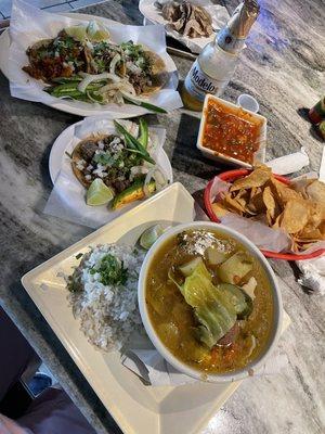 Soup, taco trio, carne asada taco, Jarritos and Modelo beer.