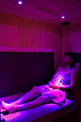 Client is relaxing in our state-of-the-art Sunlighten infrared sauna