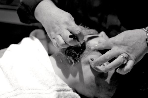 Hot lather, hot towel, straight razor shave at The Parlor Room.