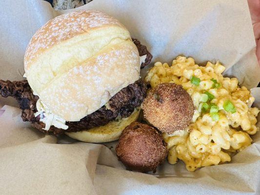 Chicken sandwich, Mac and cheese and hush puppies.