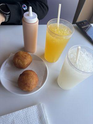 Potatoe Ball with beef Passion Fruit Juice (yellow), Jugo de guanabana (white)