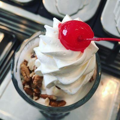 Dusty Miller Sunday - Vanilla ice cream, chocolate syrup, marshmallow cream, malted milk powder, pecans, whipped  topping, and a cherry