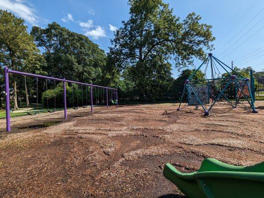 Playground with toddler and older kid play and swings with parking at Waffle House