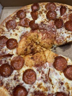 Missing the sauce, cheese and pepperoni in the middle.