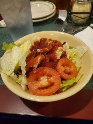 Salad with tomato basil dressing.