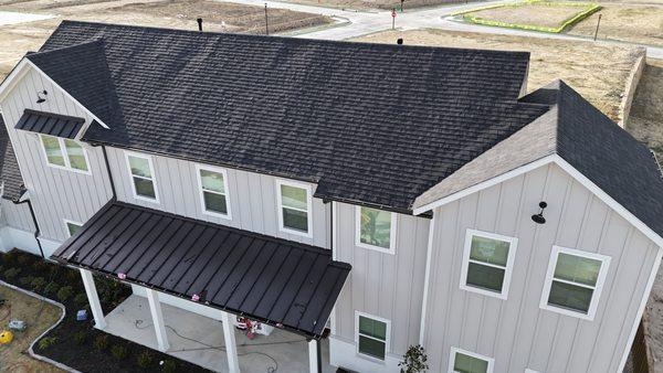 Owens Corning Roofing System in Onyx Black Architectural Shingles located in Walsh Ranch Community Aledo, Texas.