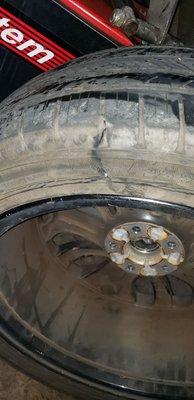 Tire damaged by careless Oviedo Road and Wrecker Service driver.