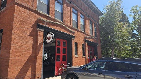 Storefront with firehouse engine-bay doors