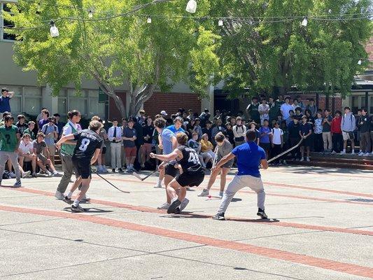 Students playing Quad Hockey at lunch break.