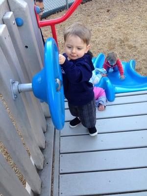 Top of the slide in the fenced toddler area