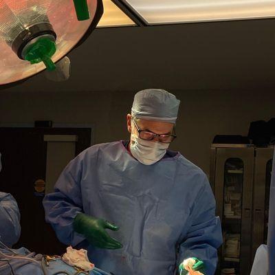 Dr. Gary D. Breslow in surgery performing Breast Implant Exchange