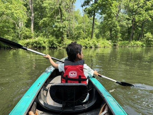 My son learning how to paddle