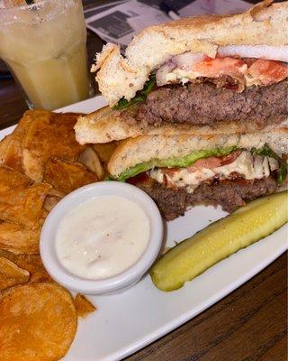 Black and blue burger with house chips