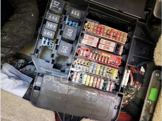 water corrosion in the fuse box, in the footwell of the passenger seat.