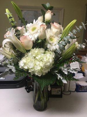 White roses, white Cala lilies, white hydrangeas, White Daisies, Dusty Miller, Eucalyptus ,,,just awesome!