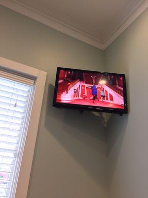 One TV of two playing "Sing" by request.