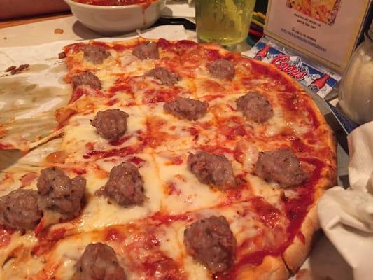 Delicious, half-eaten sausage, onion and pepperoni pizza!