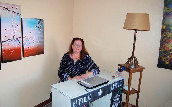 Ivory LaNoue at her desk in her reading/healing room.